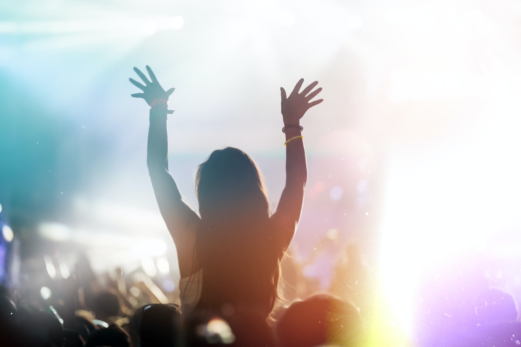 Cheering crowd at concert enjoying music performance